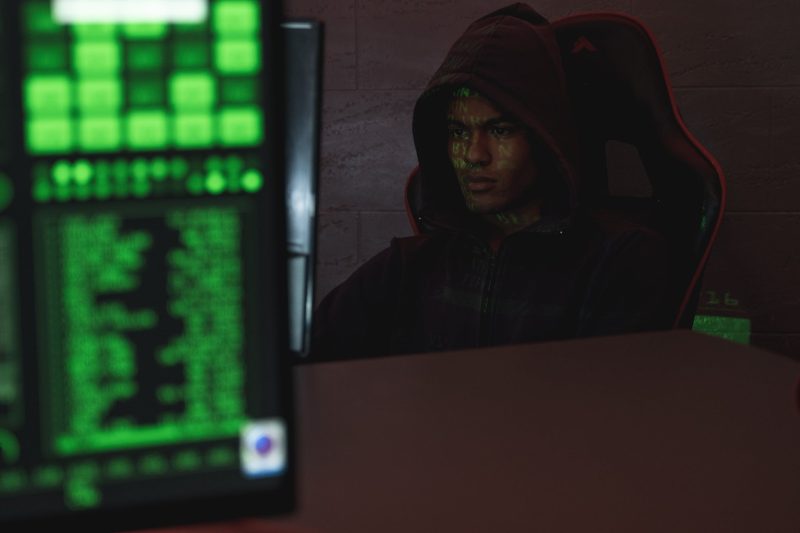 Man in hoodie hacking