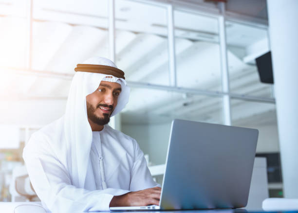Arab men working on laptop